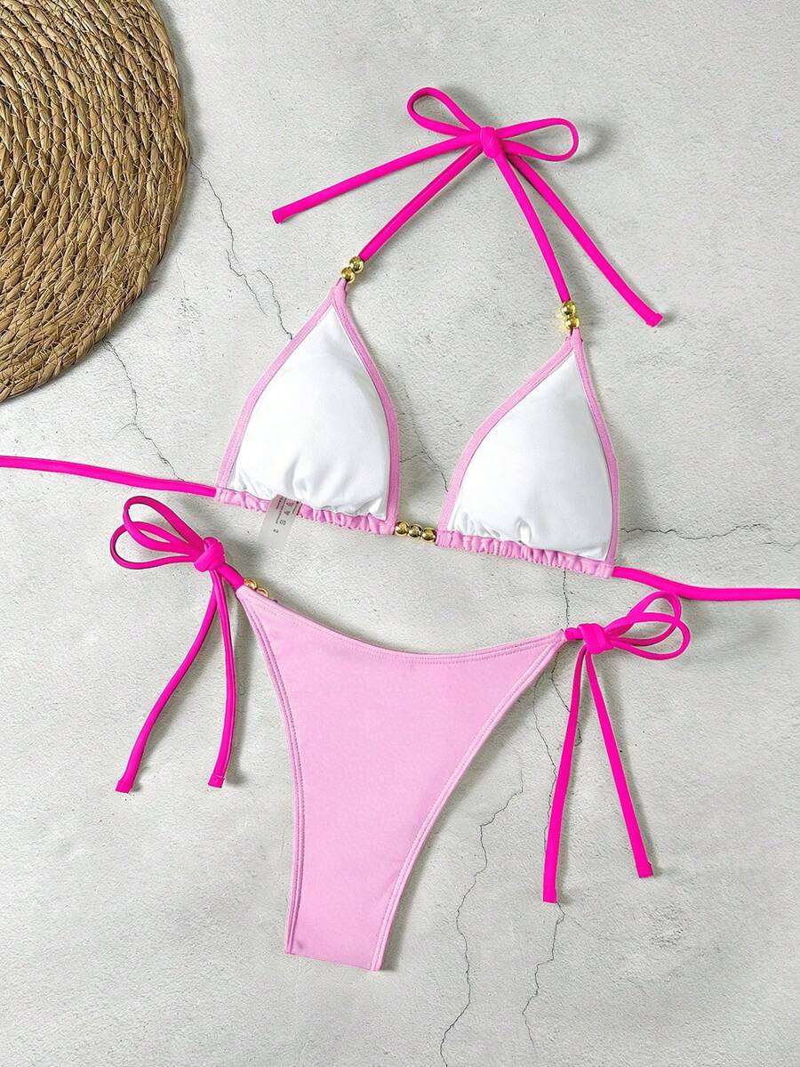 Women's black halter bikini set featuring triangle cups with gold bead decor and tie-back closure