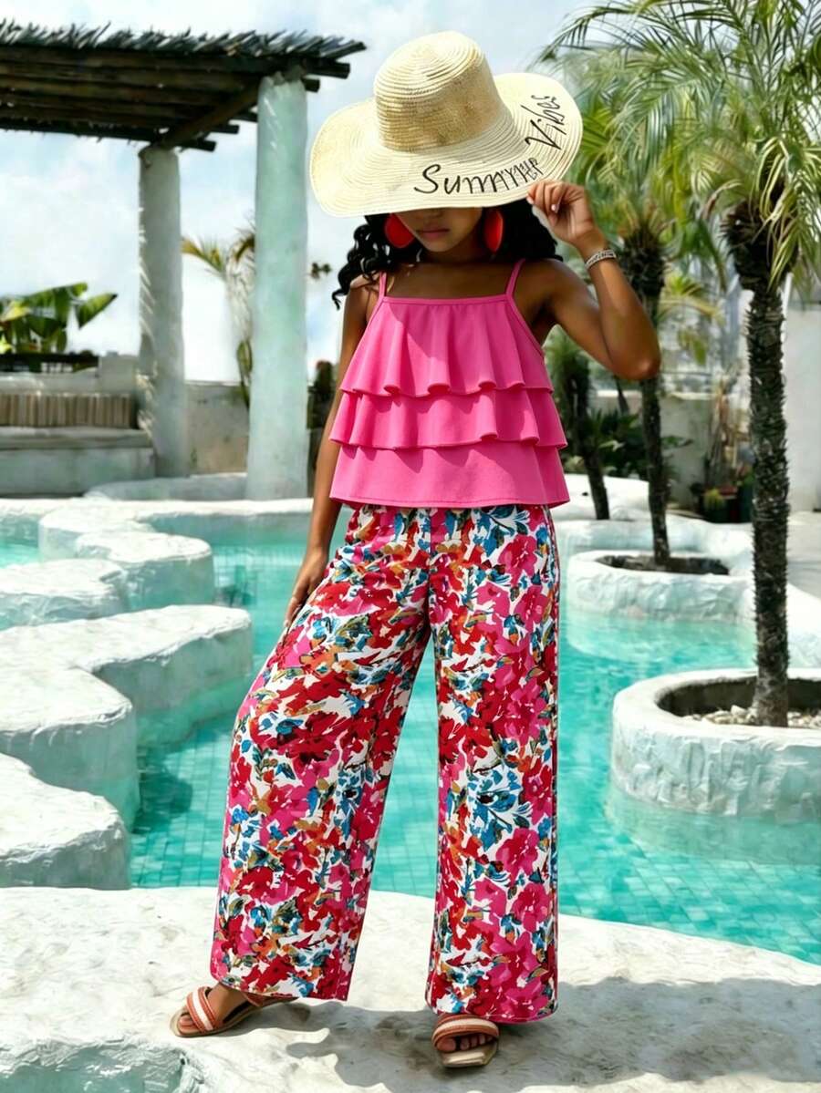 Tween girls blue 2-piece vacation outfit set featuring a tiered ruffle spaghetti strap camisole and loose high-waist pants.