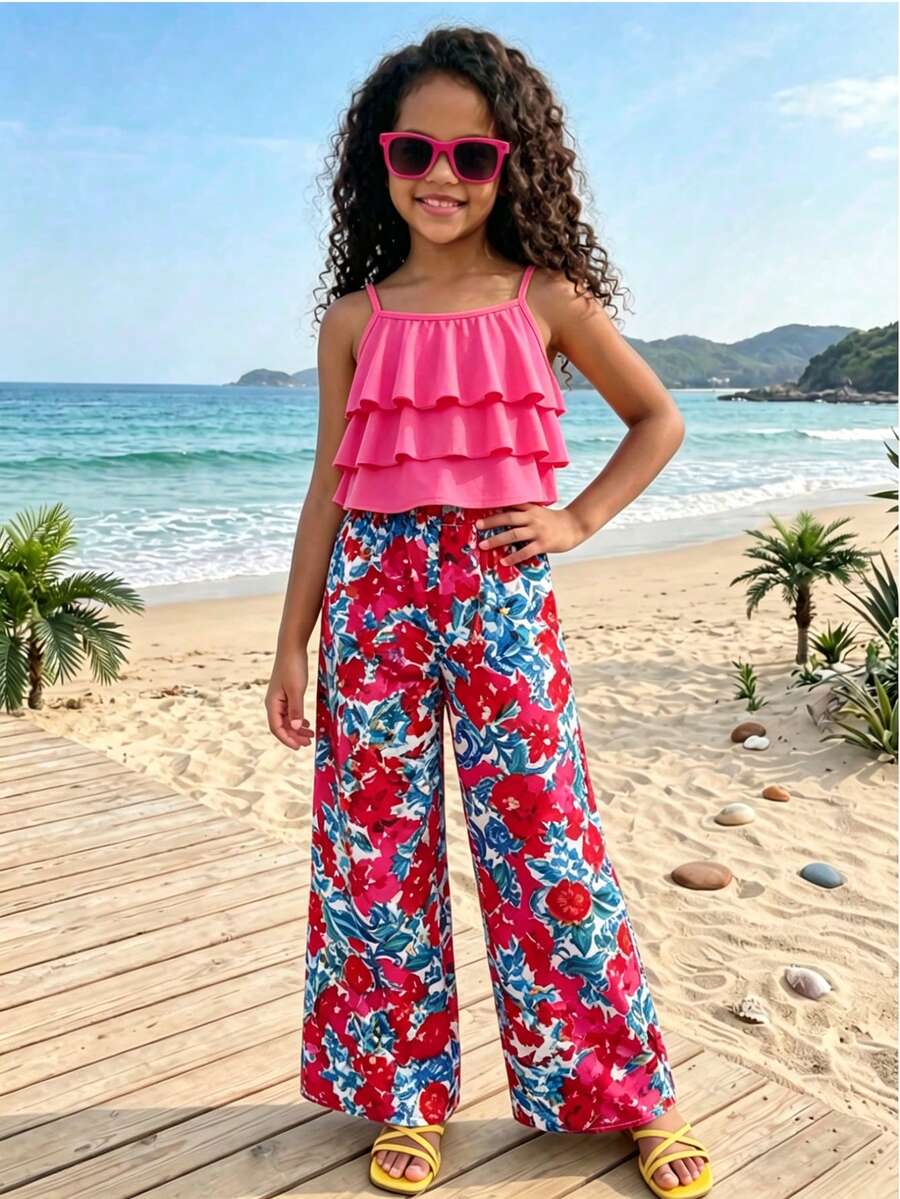 Tween girls blue 2-piece vacation outfit set featuring a tiered ruffle spaghetti strap camisole and loose high-waist pants.