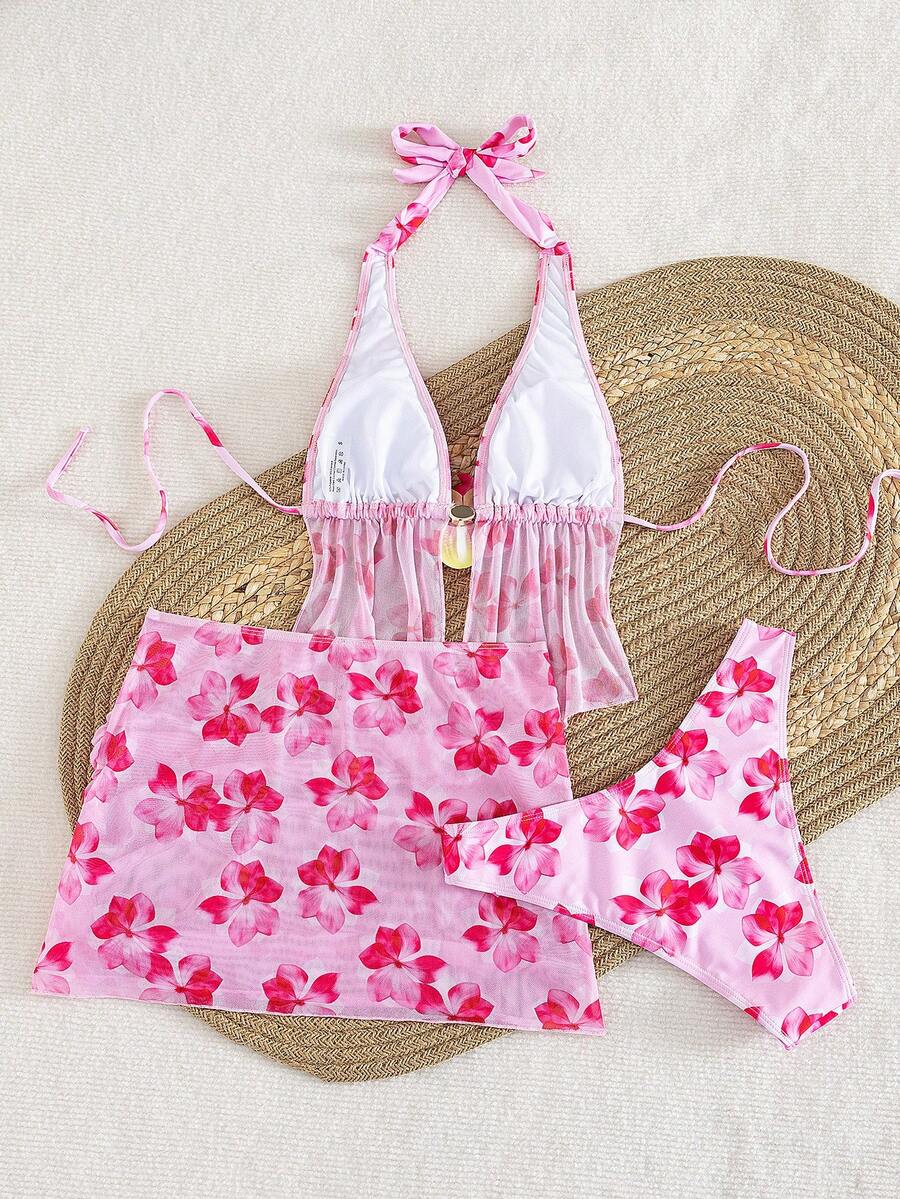 Women's 3-piece floral bikini set featuring a multicolor plant print halter top with 3D rose detail, matching bikini bottoms, and short skirt cover-up
