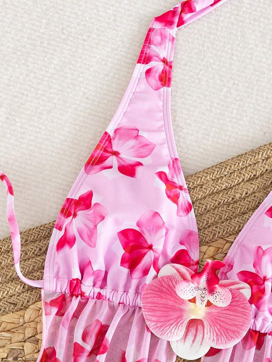 Women's 3-piece floral bikini set featuring a multicolor plant print halter top with 3D rose detail, matching bikini bottoms, and short skirt cover-up
