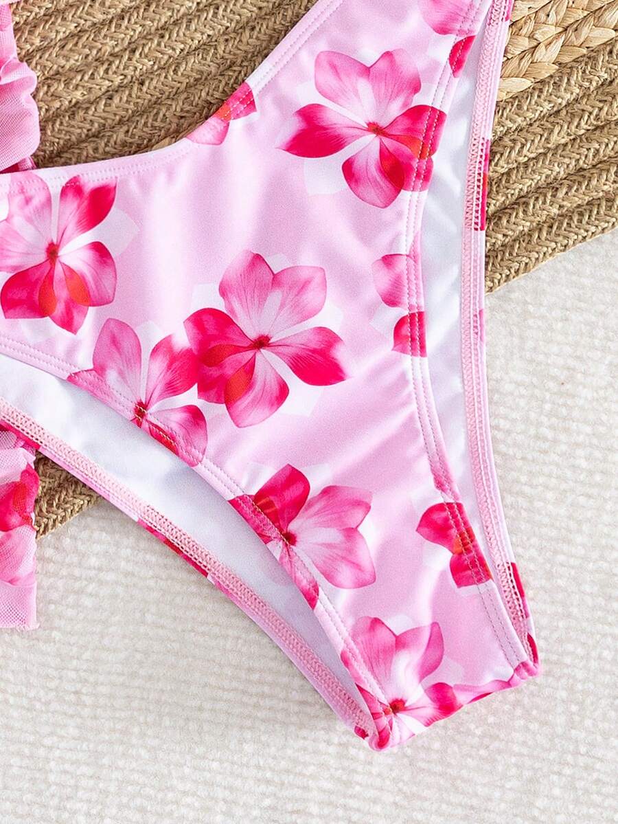 Women's 3-piece floral bikini set featuring a multicolor plant print halter top with 3D rose detail, matching bikini bottoms, and short skirt cover-up