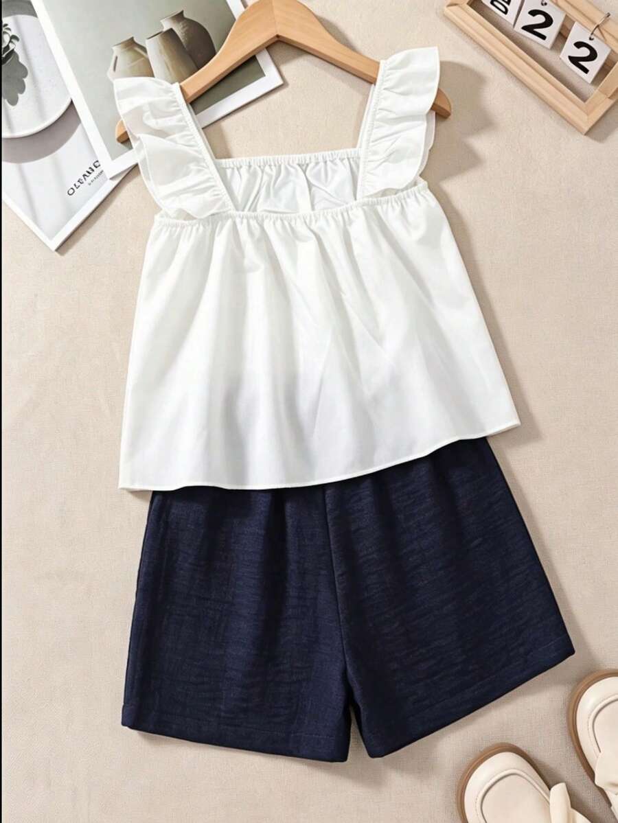 Tween girls 2-piece bohemian outfit set in apricot featuring a square neck embroidered sleeveless camisole top and matching floral wide leg shorts.