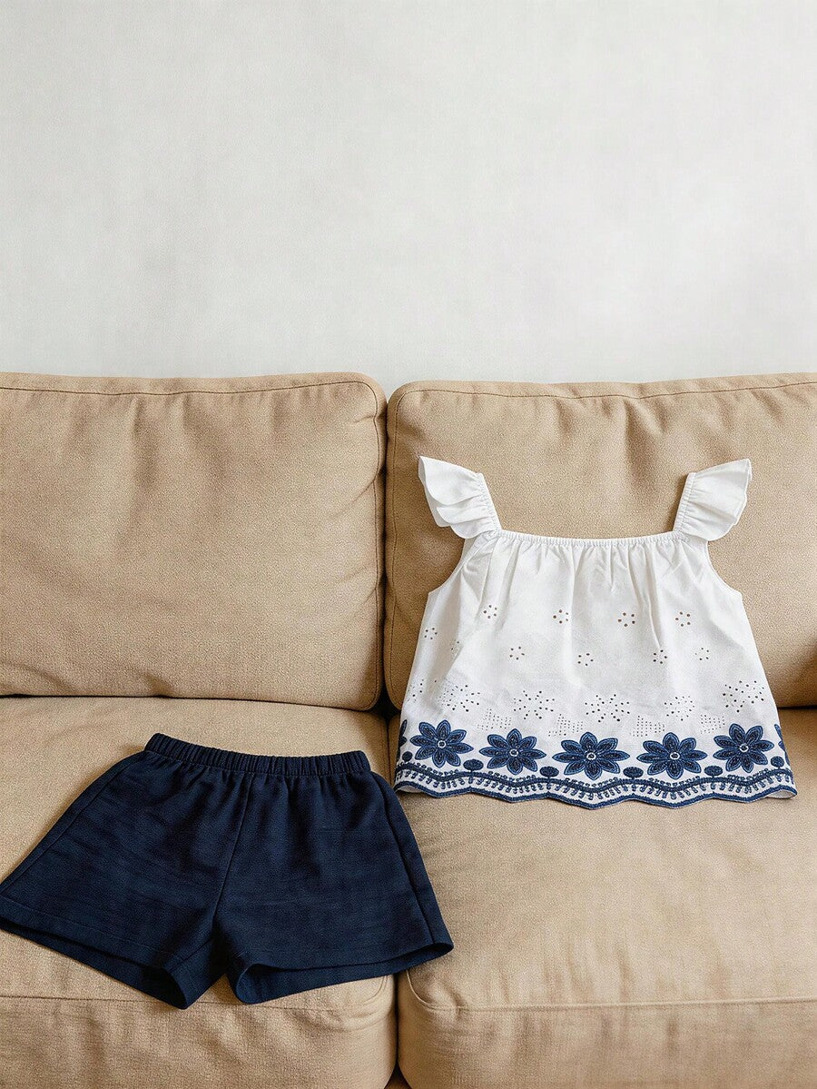 Tween girls 2-piece bohemian outfit set in apricot featuring a square neck embroidered sleeveless camisole top and matching floral wide leg shorts.