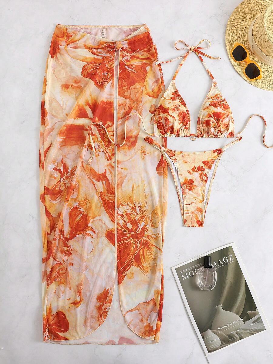 Women's 3-piece floral swimsuit set featuring a multicolor tie-back halter bikini top, low-waist bottoms, and a matching sheer mesh maxi skirt.