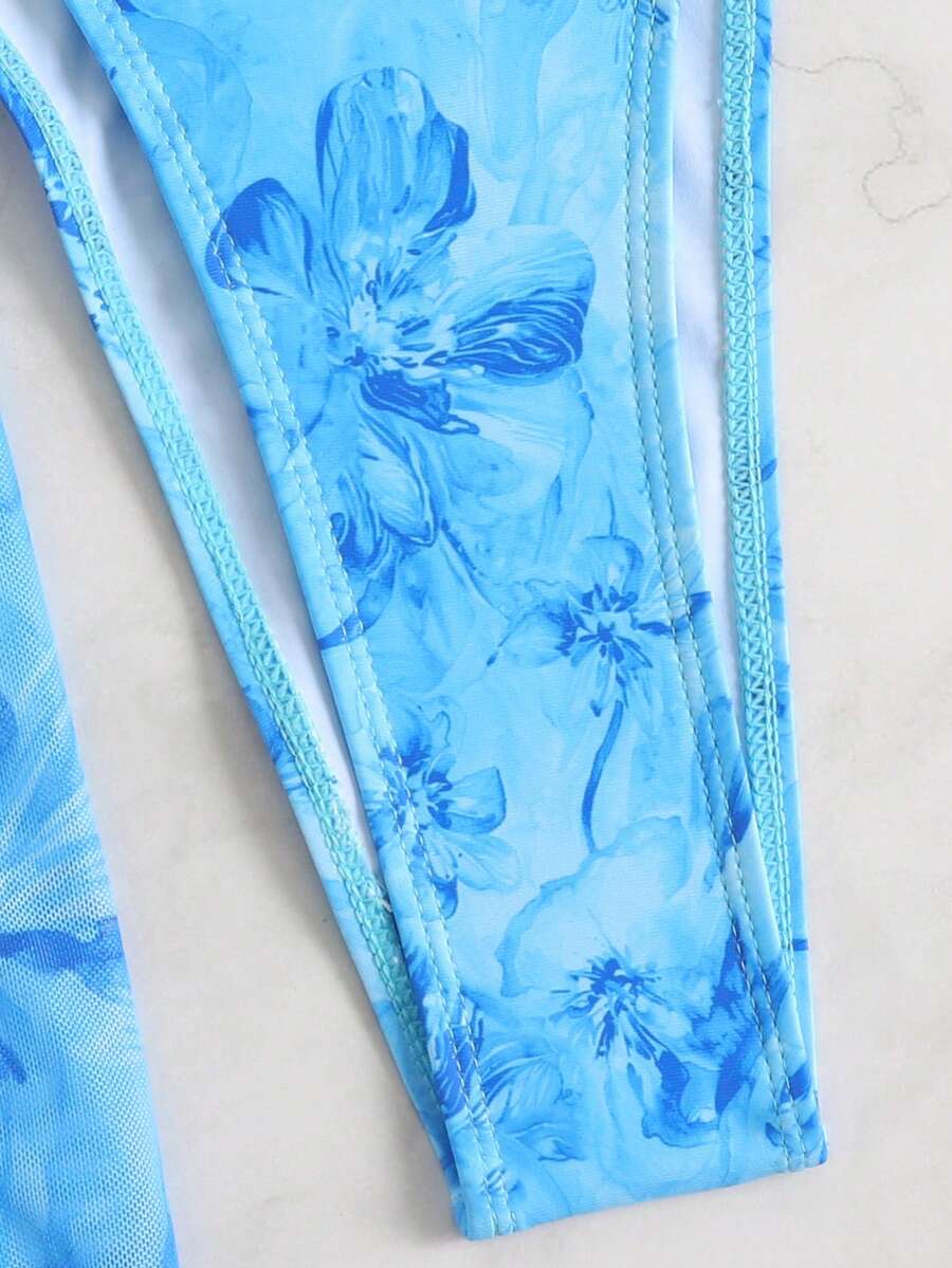 Women's 3-piece floral swimsuit set featuring a multicolor tie-back halter bikini top, low-waist bottoms, and a matching sheer mesh maxi skirt.