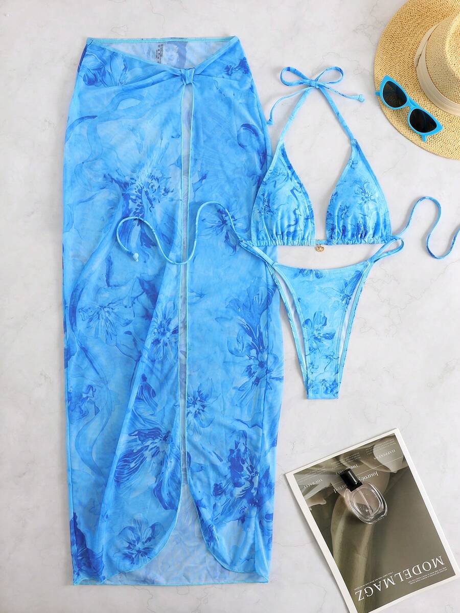 Women's 3-piece floral swimsuit set featuring a multicolor tie-back halter bikini top, low-waist bottoms, and a matching sheer mesh maxi skirt.