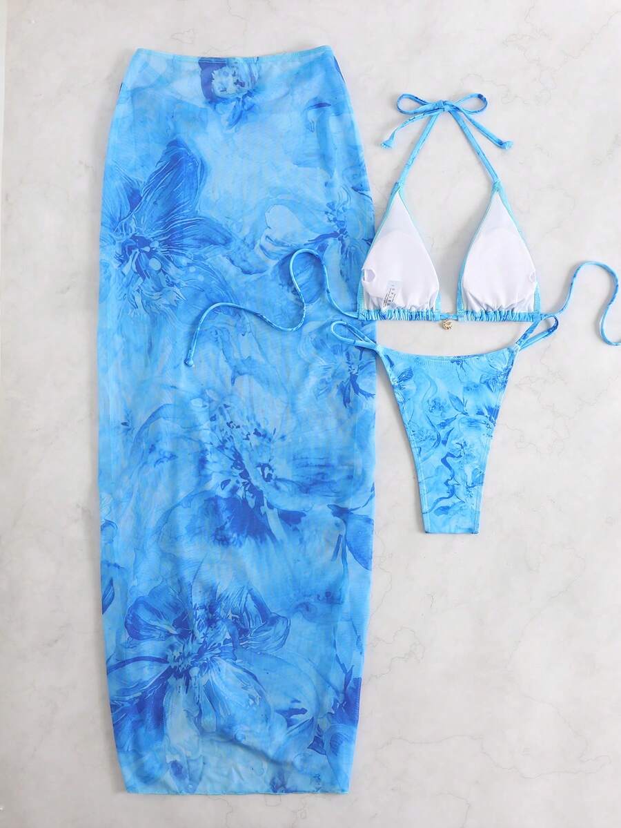 Women's 3-piece floral swimsuit set featuring a multicolor tie-back halter bikini top, low-waist bottoms, and a matching sheer mesh maxi skirt.