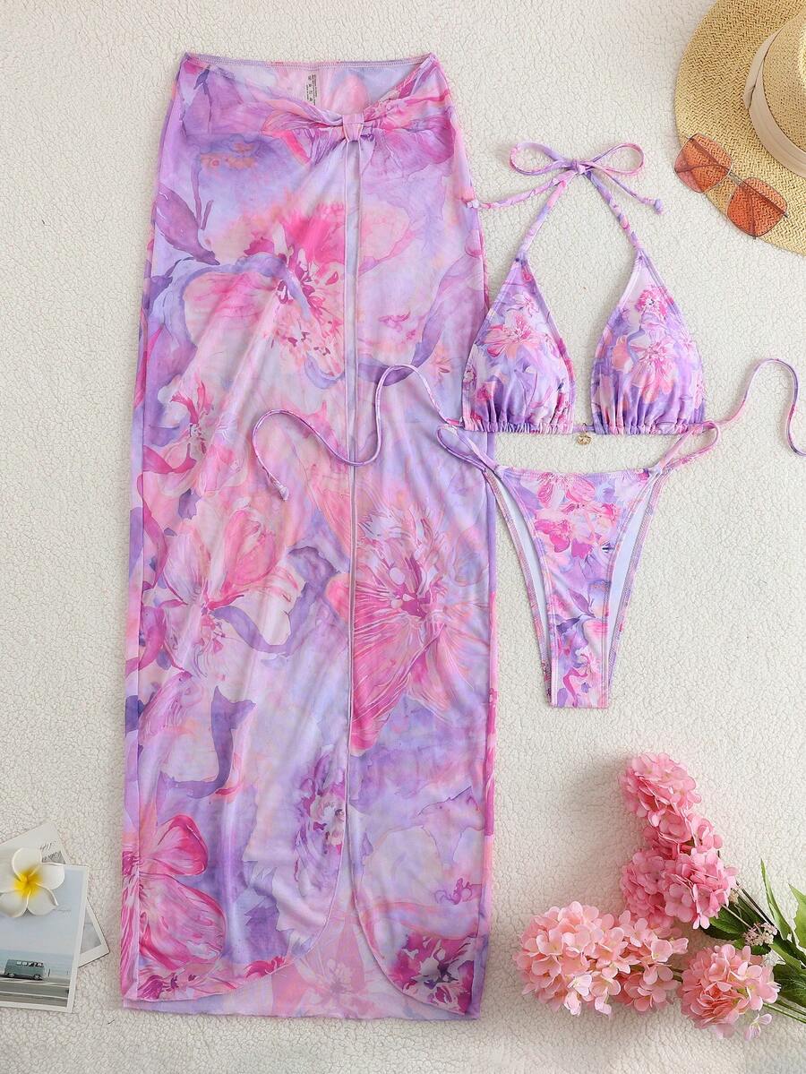 Women's 3-piece floral swimsuit set featuring a multicolor tie-back halter bikini top, low-waist bottoms, and a matching sheer mesh maxi skirt.