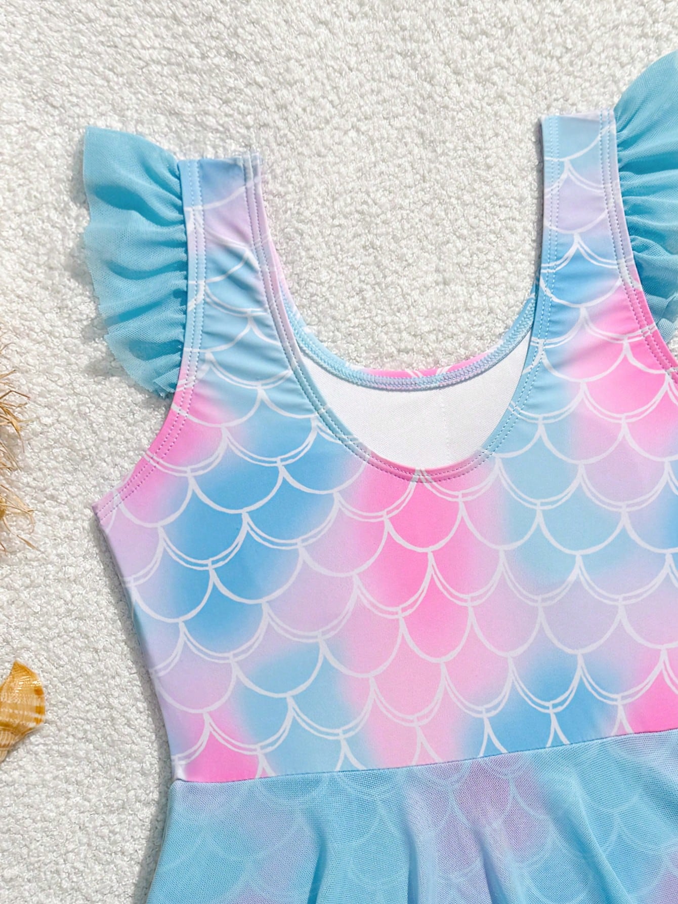 Tween girl one-piece swimsuit with multicolor fish scale graphic print, ruffle details, contrast mesh, round neck, and skirt bottom for beach or pool wear
