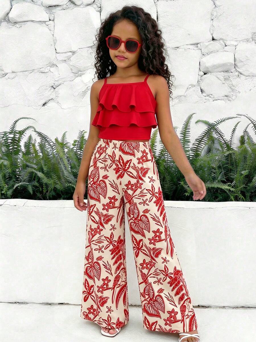 Tween girls blue 2-piece vacation outfit set featuring a tiered ruffle spaghetti strap camisole and loose high-waist pants.