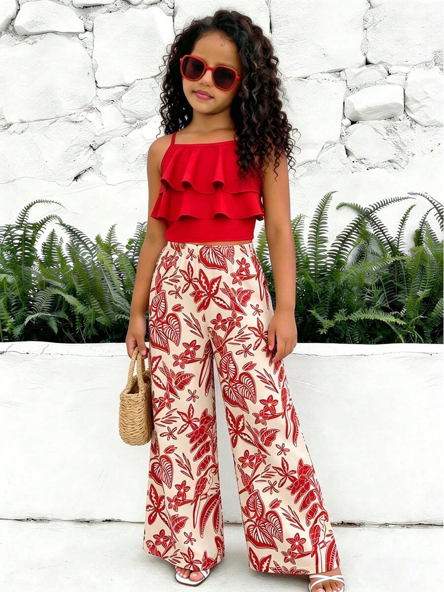 Tween girls blue 2-piece vacation outfit set featuring a tiered ruffle spaghetti strap camisole and loose high-waist pants.