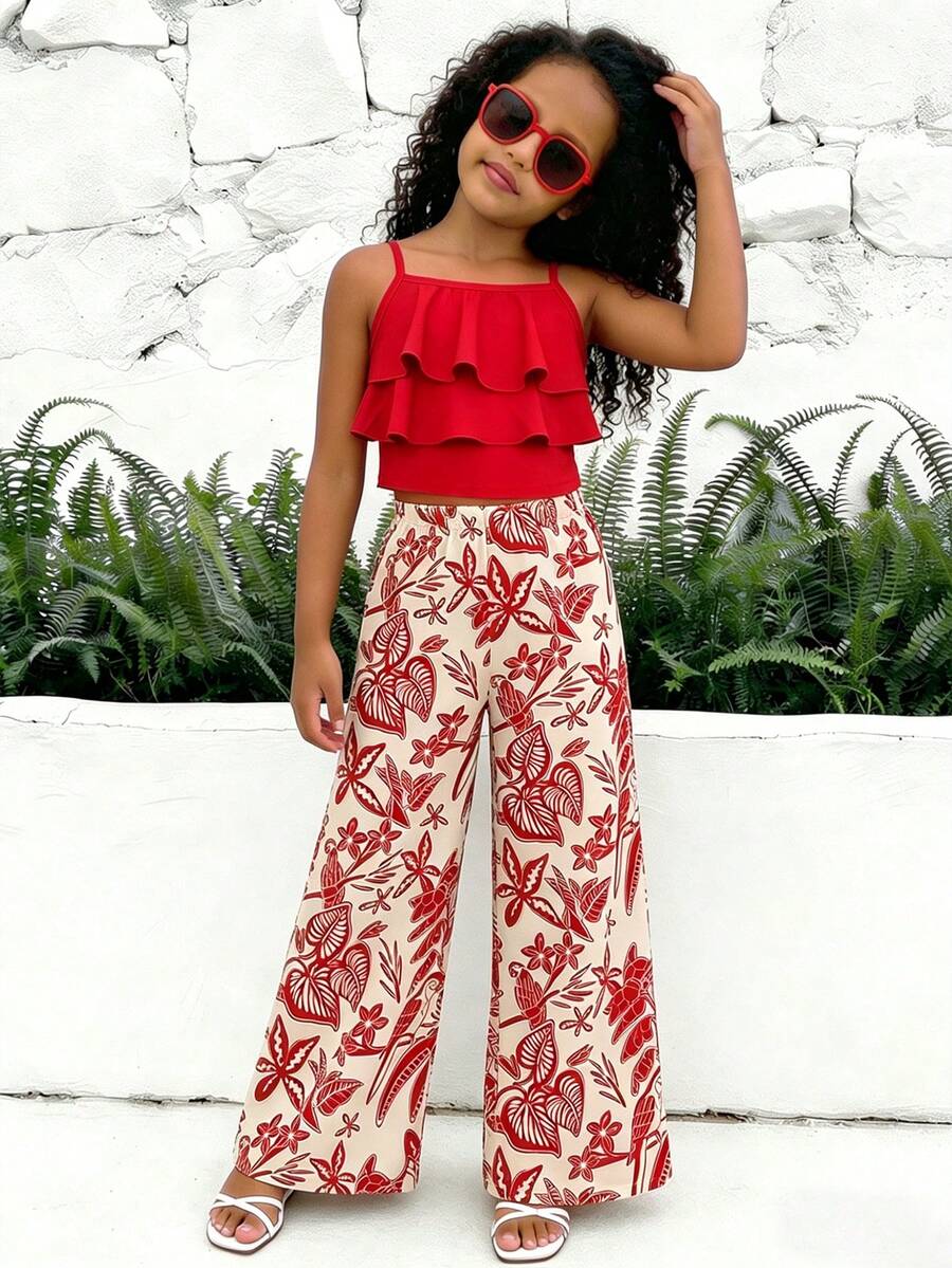 Tween girls blue 2-piece vacation outfit set featuring a tiered ruffle spaghetti strap camisole and loose high-waist pants.