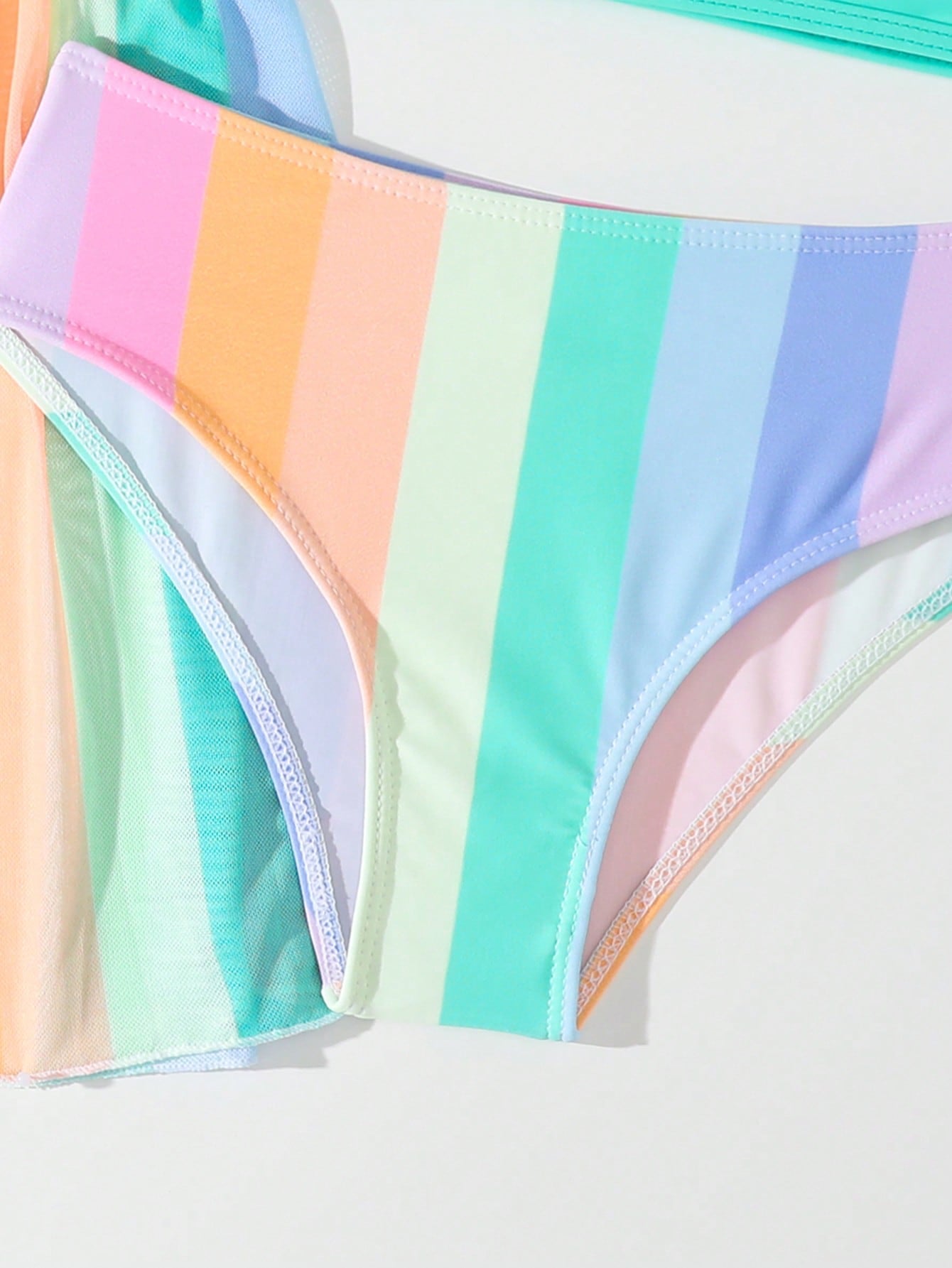 Tween girls 3-piece striped swimwear set featuring a tankini top, mid-waist bikini bottoms with a drawstring waist, and a matching kimono cover-up for beach or vacation wear.