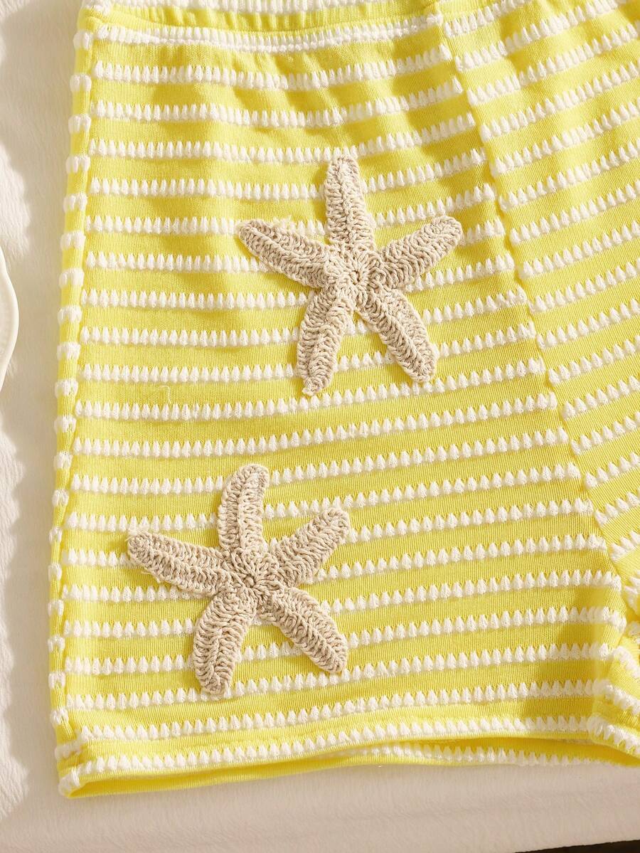 Tween girls black and white striped two-piece set featuring a spaghetti strap micro crop tank top with lettuce trim and ruffle hem paired with matching slim fit shorts.