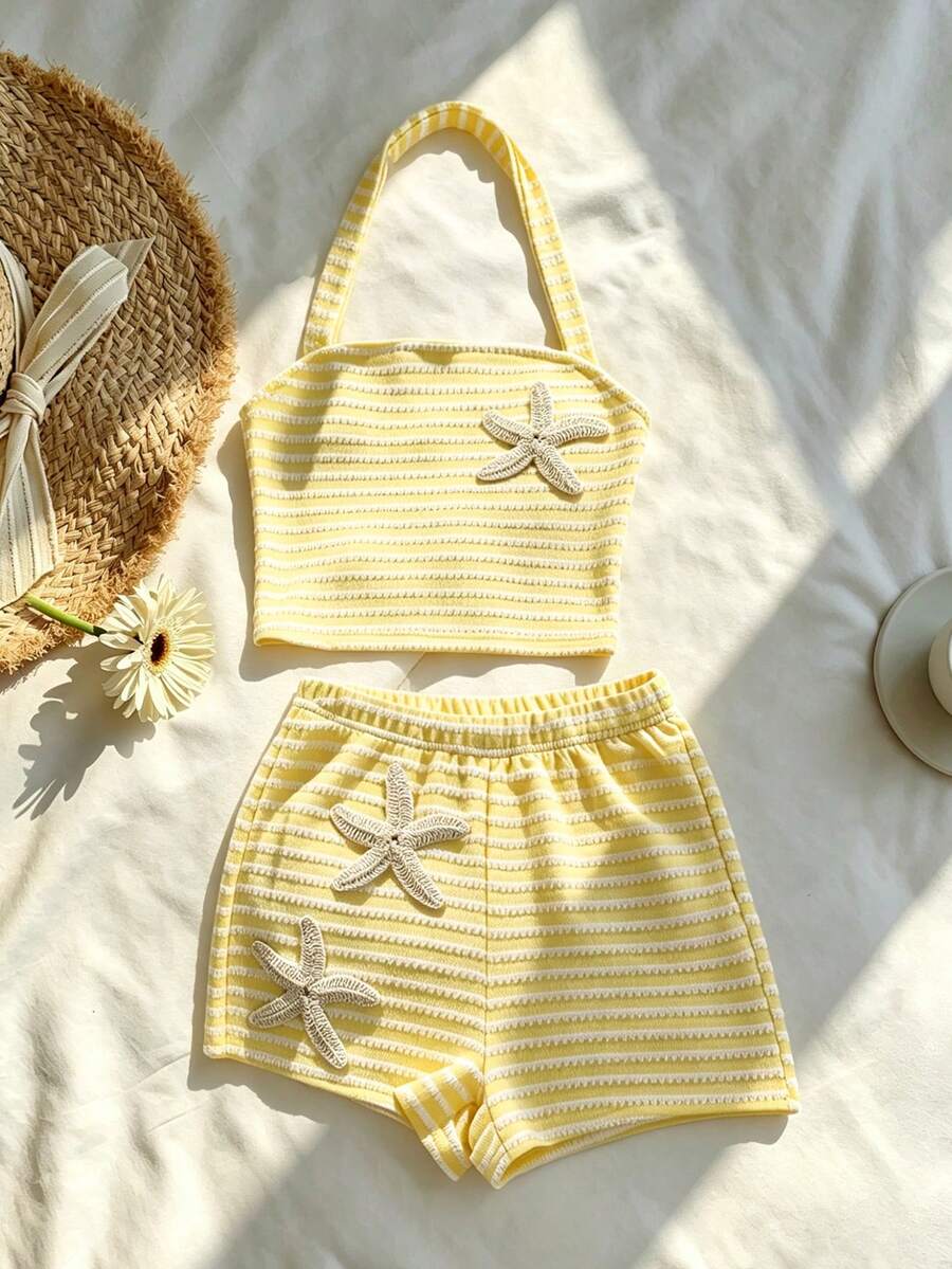 Tween girls black and white striped two-piece set featuring a spaghetti strap micro crop tank top with lettuce trim and ruffle hem paired with matching slim fit shorts.
