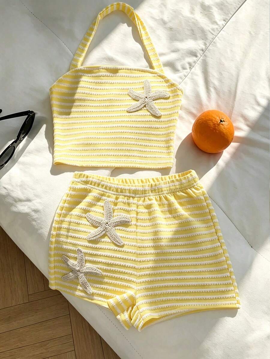 Tween girls black and white striped two-piece set featuring a spaghetti strap micro crop tank top with lettuce trim and ruffle hem paired with matching slim fit shorts.