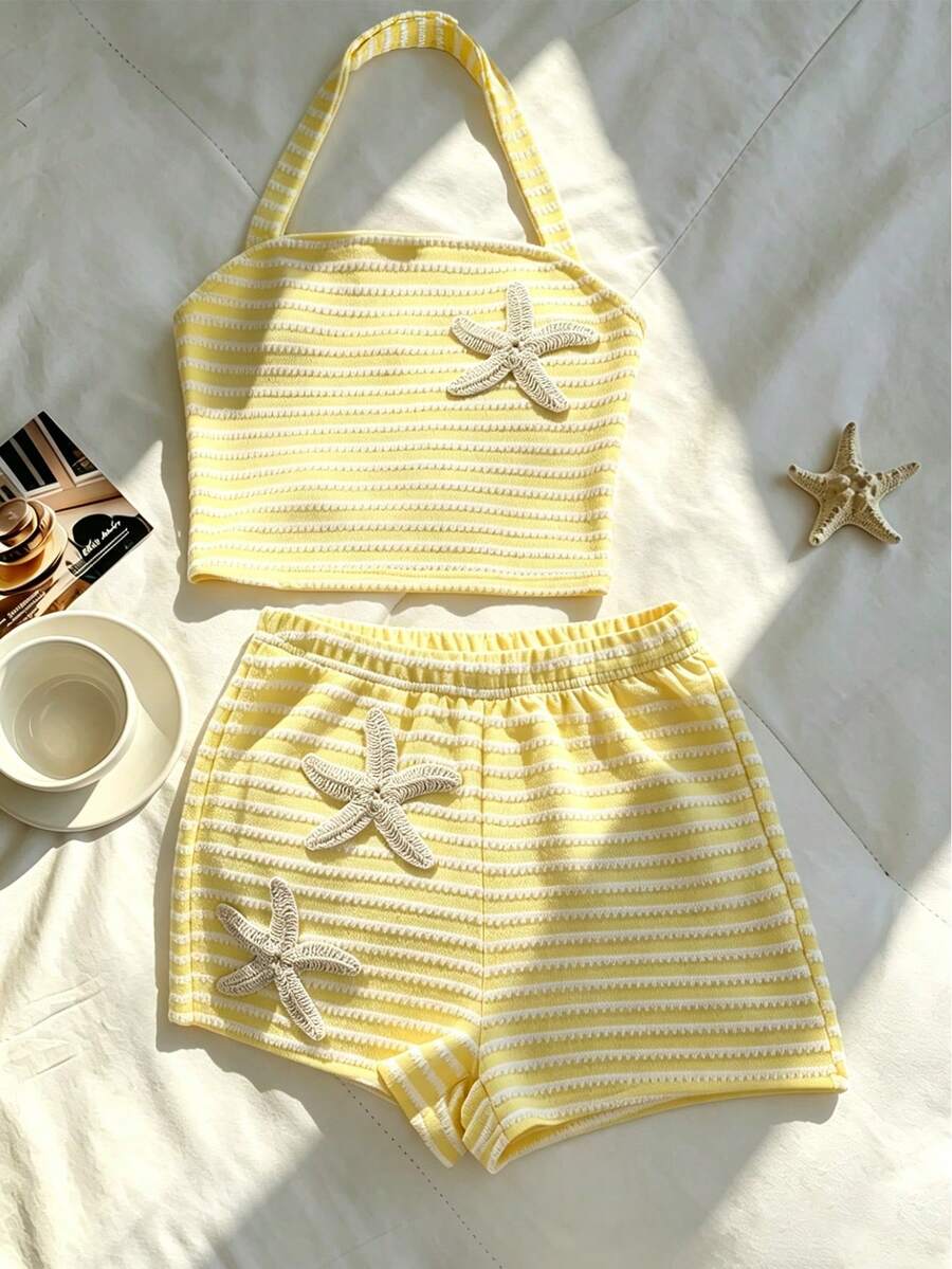 Tween girls black and white striped two-piece set featuring a spaghetti strap micro crop tank top with lettuce trim and ruffle hem paired with matching slim fit shorts.