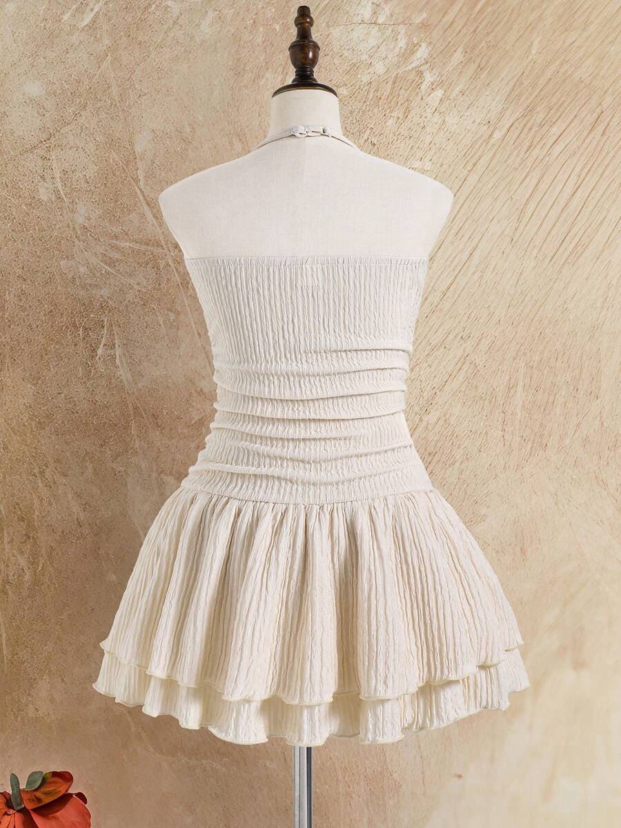 Tween girls apricot sleeveless halter mini dress with textured starfish and shell decor, shirred tiered layer, high waist, and flounce hem.