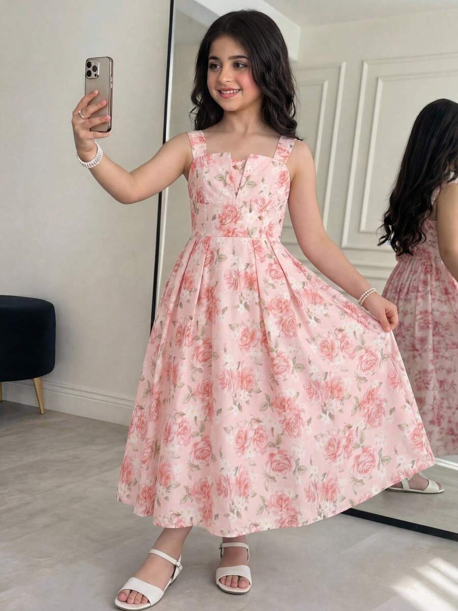 Tween girl apricot floral print midi dress with ruffle shoulder straps, shirred detail, and high waist A-line fit.