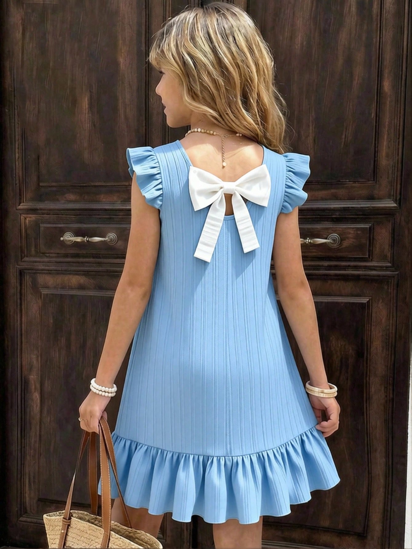 Tween girls apricot vacation midi dress featuring a round neck, cut out details, ruffle flounce accents, and geometric pattern.