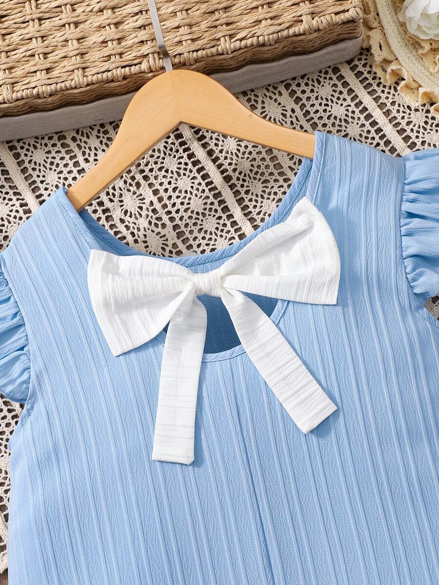 Tween girls apricot vacation midi dress featuring a round neck, cut out details, ruffle flounce accents, and geometric pattern.