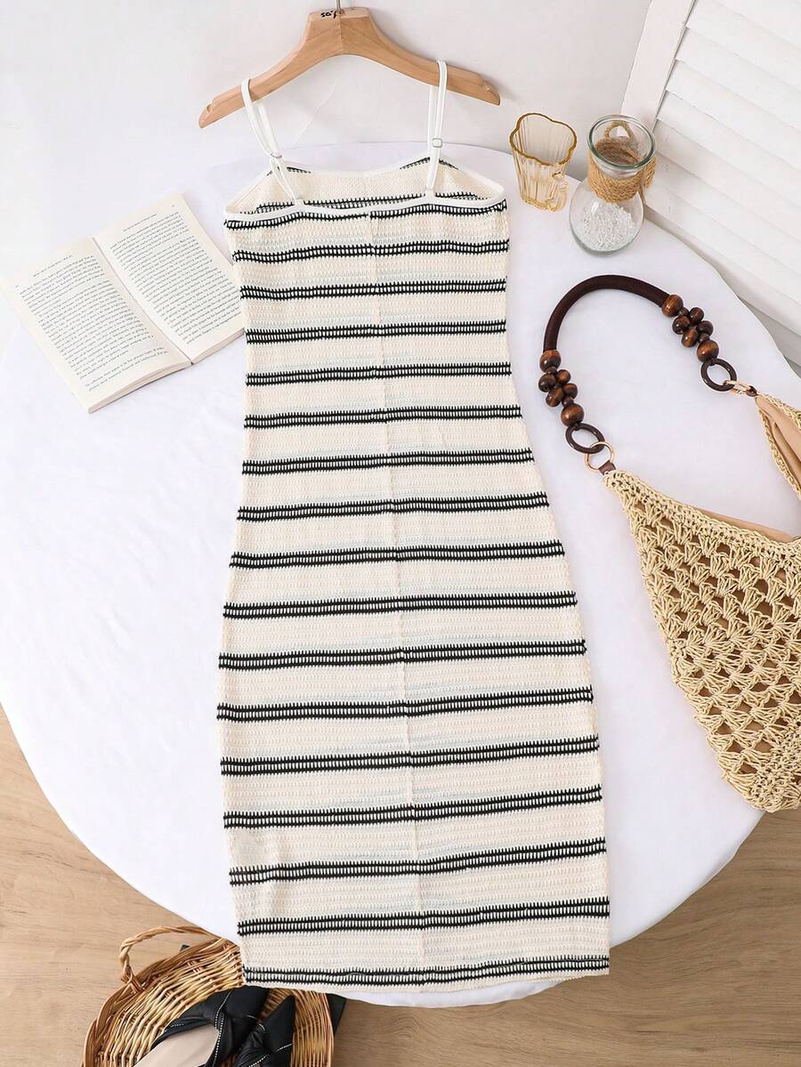 Tween girls black cami midi dress featuring plant print, spaghetti straps, slim fit, and a flared hem.