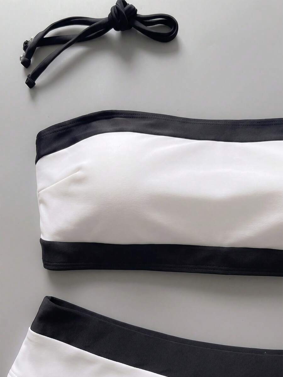 Women's bandeau bikini swimwear set featuring detachable shoulder straps, removable padding, wireless cups, and low-waist bottoms.