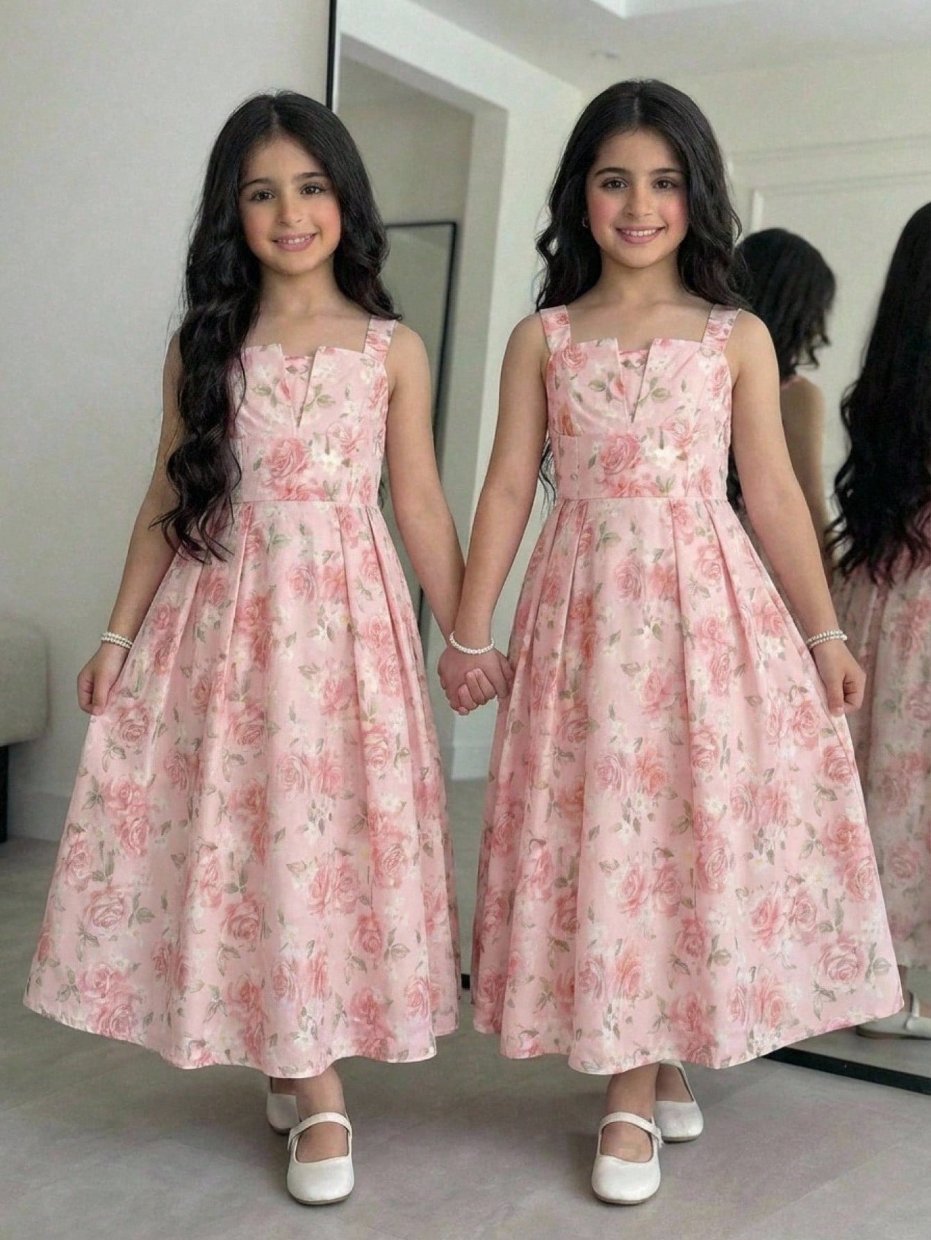 Tween girl apricot floral print midi dress with ruffle shoulder straps, shirred detail, and high waist A-line fit.