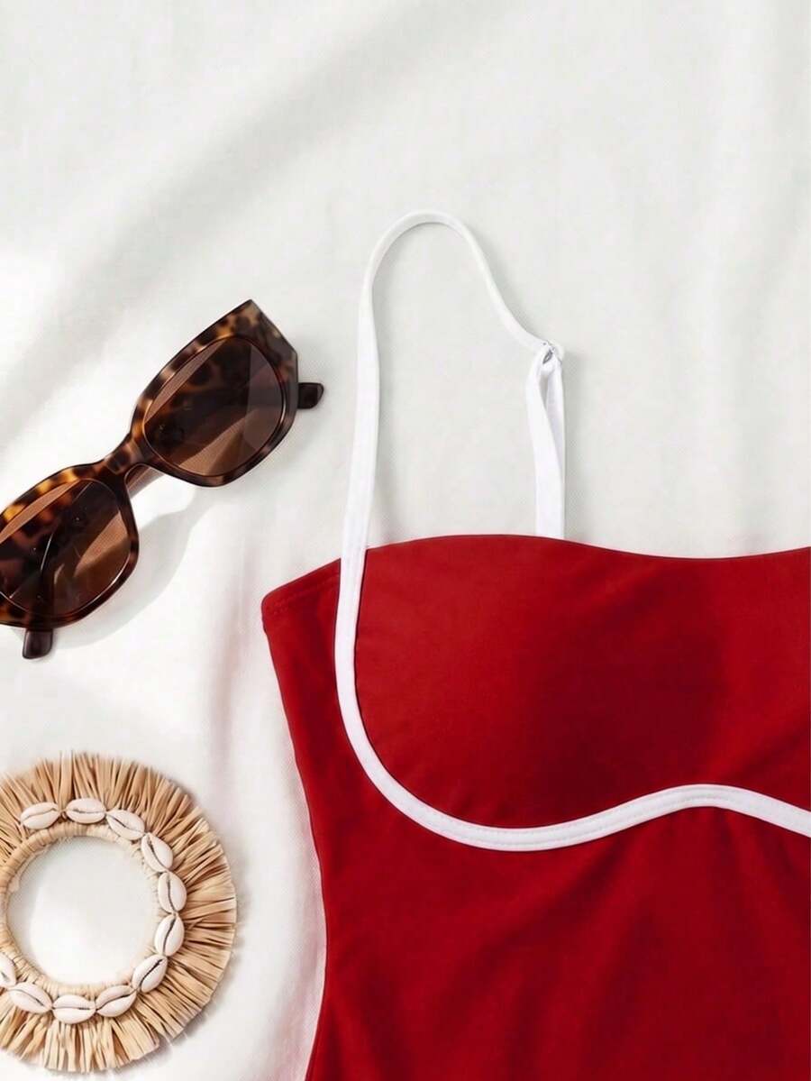 Black colorblock women's one-piece swimsuit with spaghetti straps and high stretch fabric.