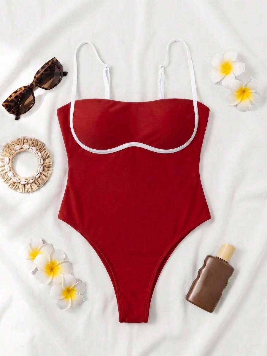Black colorblock women's one-piece swimsuit with spaghetti straps and high stretch fabric.