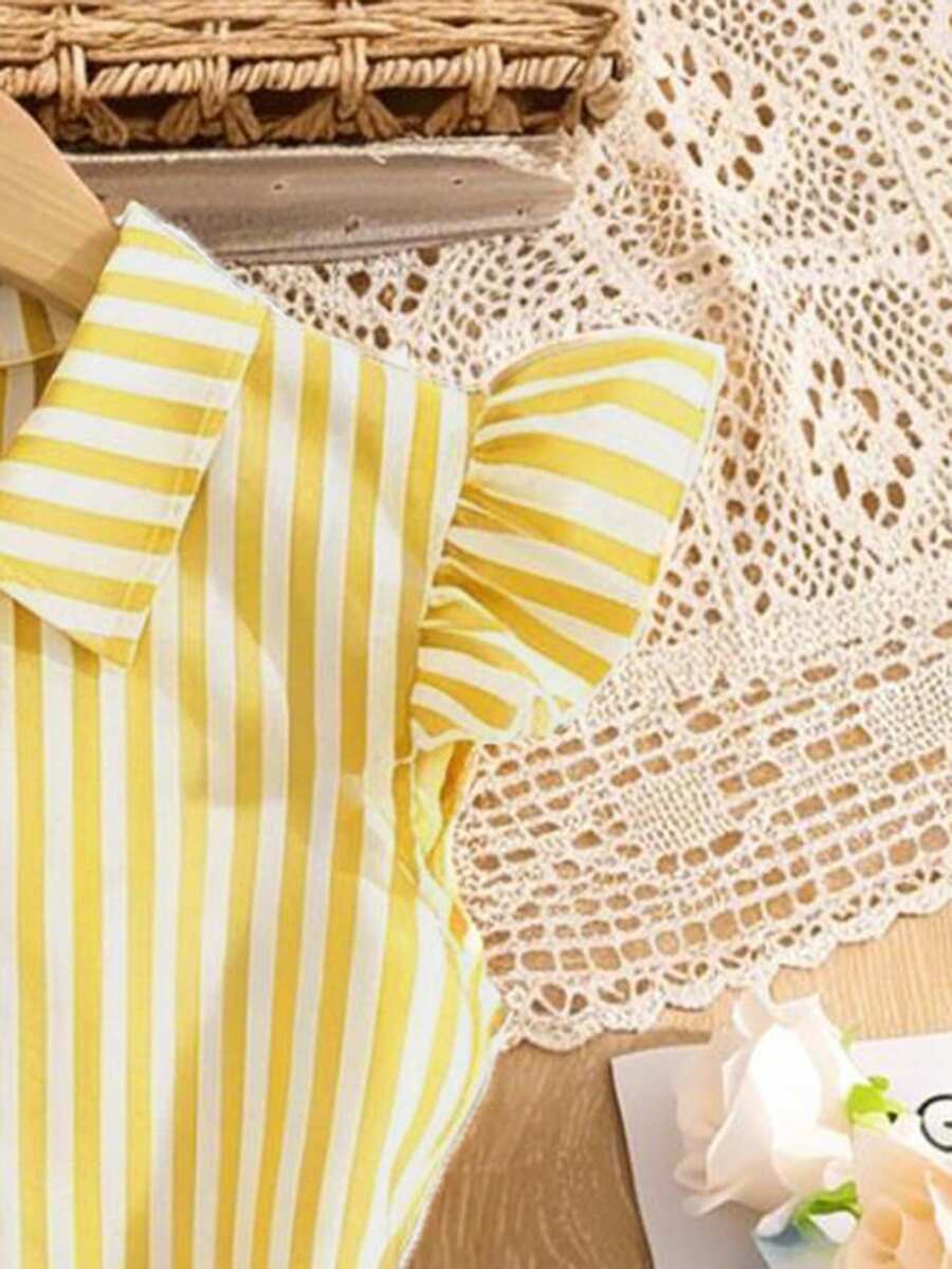 Tween girls blue and white striped casual shirt dress featuring a collared neckline, button front, and flounce sleeves by Left Mama.