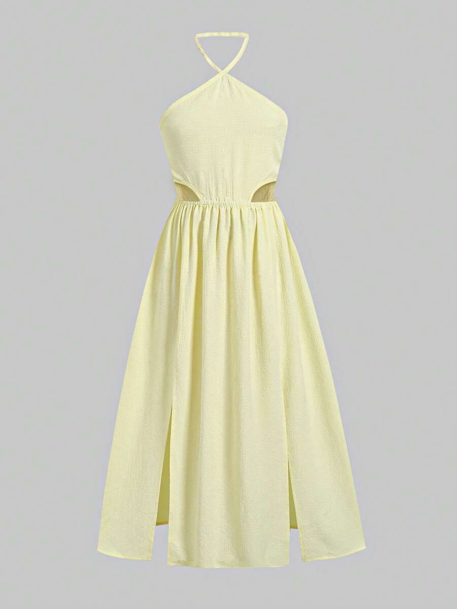 Tween girl yellow long halter dress with cutout waist, split detail, shirred textured fabric, sleeveless design, high waist, and flared hem for beach vacation wear.