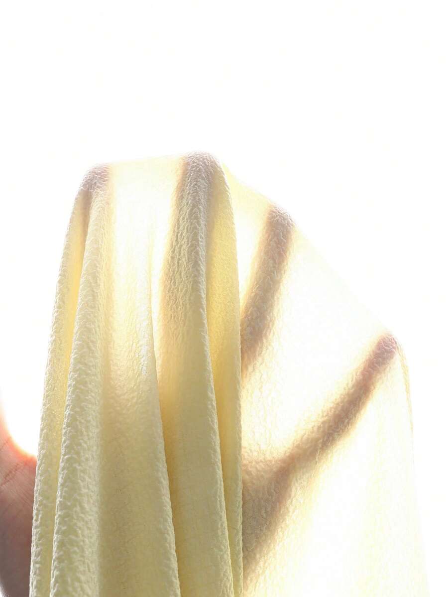 Tween girl yellow long halter dress with cutout waist, split detail, shirred textured fabric, sleeveless design, high waist, and flared hem for beach vacation wear.