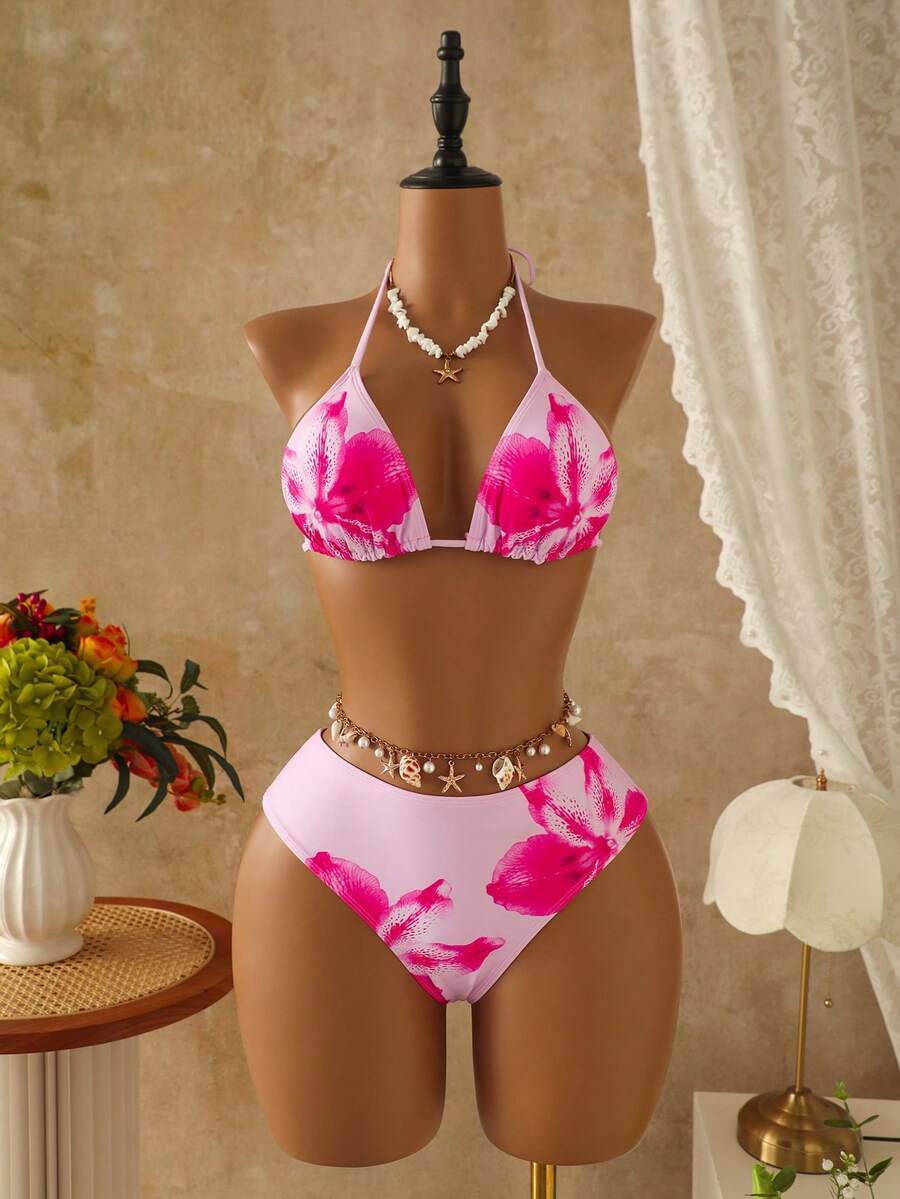 Women's black 3-piece bikini set featuring a halter triangle top with removable padding, high-waisted bottoms, and a knee-length mesh skirt with tie details.