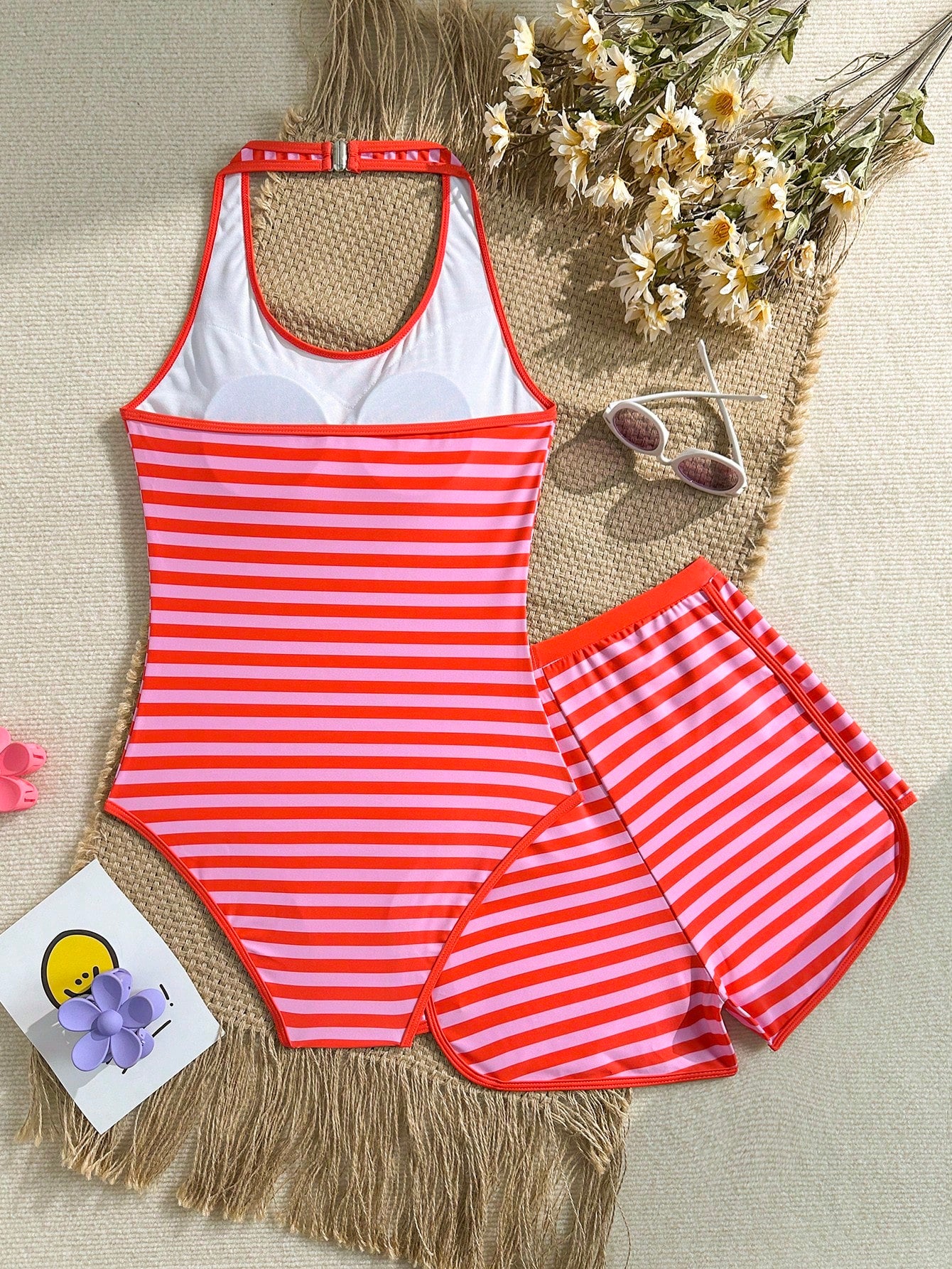 Girls 2-piece swimwear set featuring a butterfly print halter swimsuit top with contrast piping and separate mid-waist shorts; sleeveless, high-stretch, wireless design for beach and vacation wear.