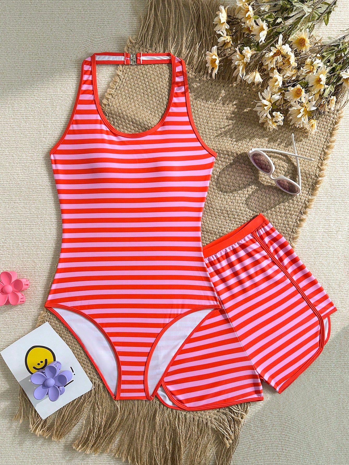 Girls 2-piece swimwear set featuring a butterfly print halter swimsuit top with contrast piping and separate mid-waist shorts; sleeveless, high-stretch, wireless design for beach and vacation wear.