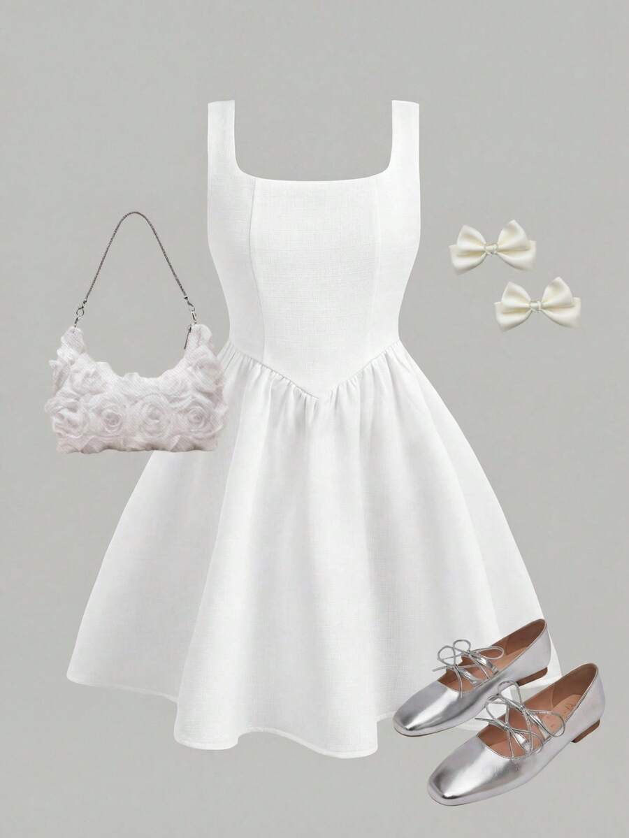 Black and white polka dot sleeveless A-line dress for tween girls featuring a scoop neck, high waist, and flared hem.