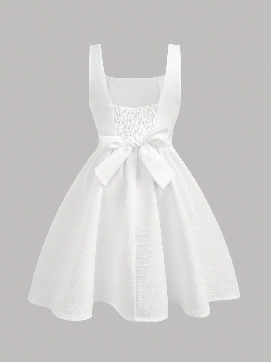 Black and white polka dot sleeveless A-line dress for tween girls featuring a scoop neck, high waist, and flared hem.