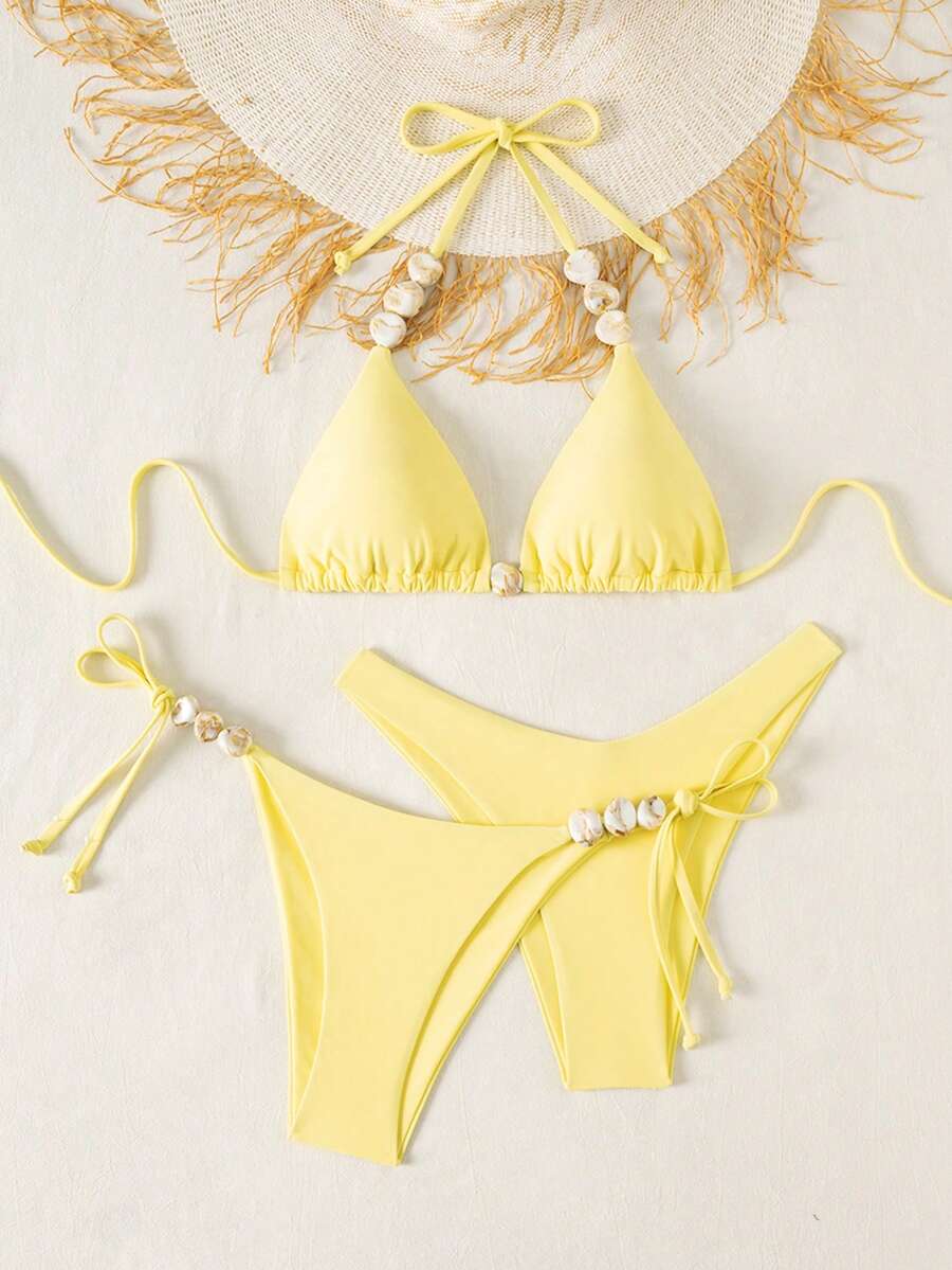 Women's triangle bikini set with contrast lace wireless bra top and ultra high waist tie side bottoms.