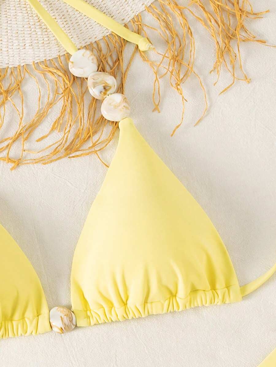 Women's triangle bikini set with contrast lace wireless bra top and ultra high waist tie side bottoms.