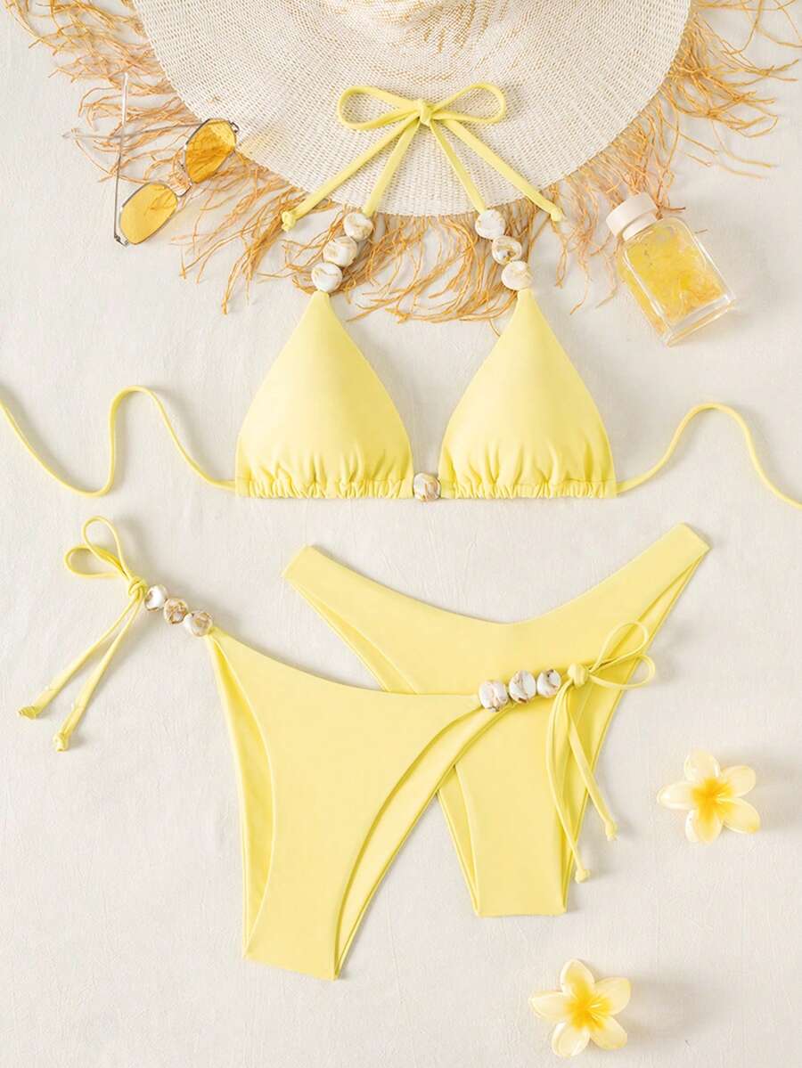 Women's triangle bikini set with contrast lace wireless bra top and ultra high waist tie side bottoms.