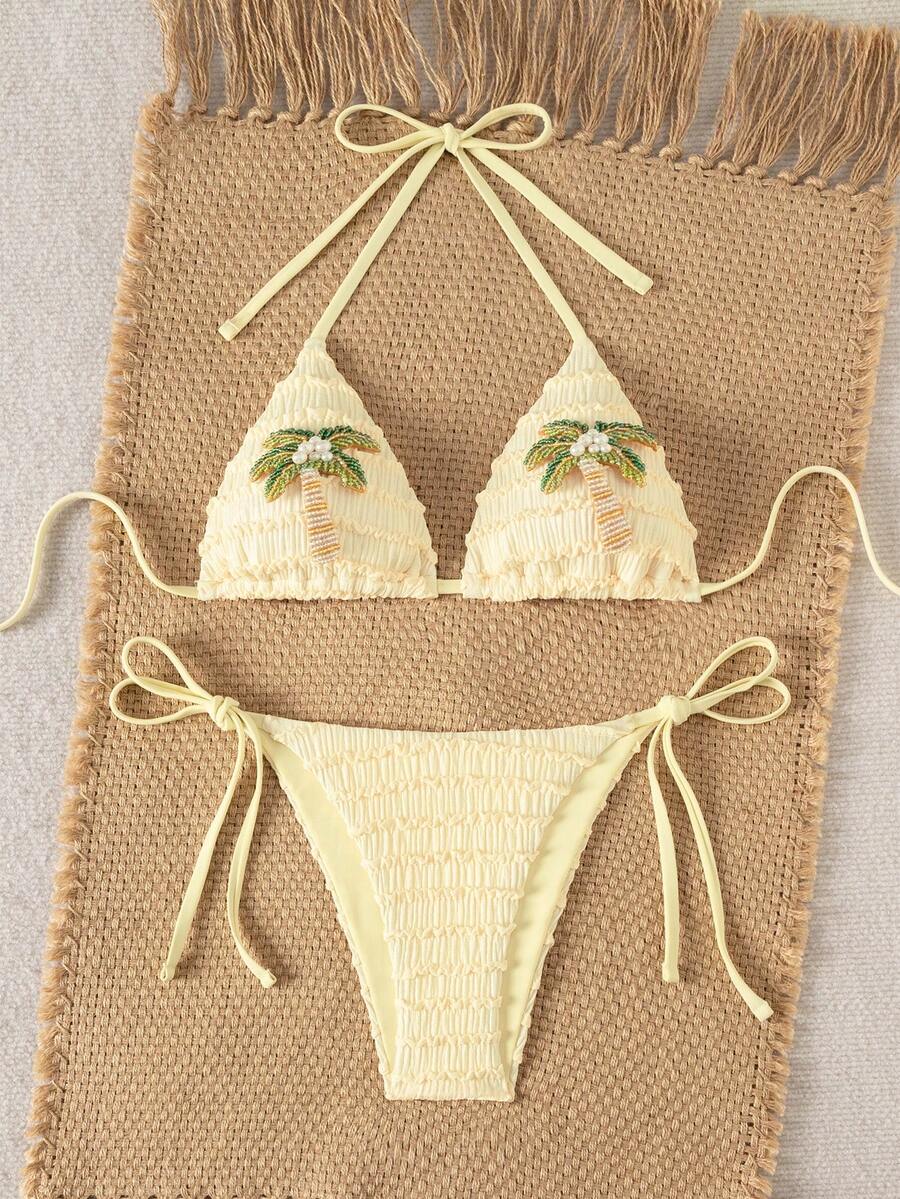Women's triangle bikini set with contrast lace wireless bra top and ultra high waist tie side bottoms.