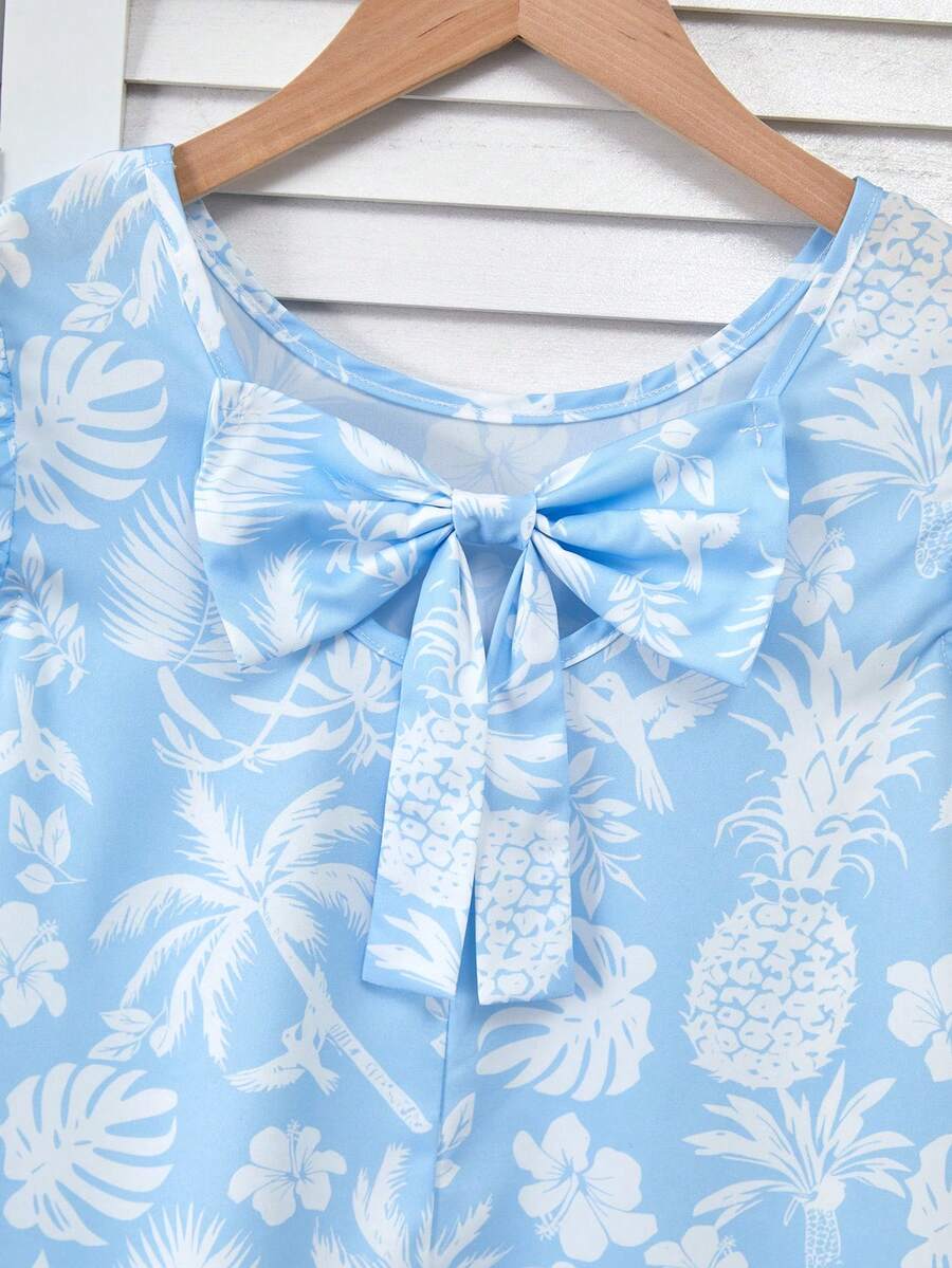 Tween girls apricot vacation midi dress featuring a round neck, cut out details, ruffle flounce accents, and geometric pattern.