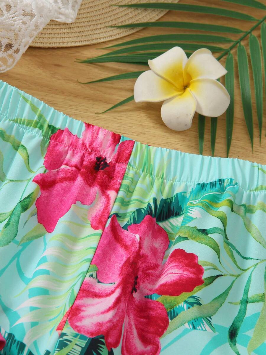 Tween girls blue 2-piece vacation outfit set featuring a tiered ruffle spaghetti strap camisole and loose high-waist pants.