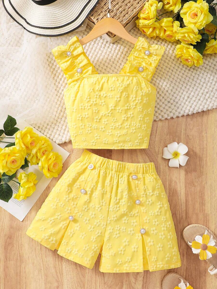 Apricot two-piece summer outfit for tween girls featuring a sleeveless pleated square-neck camisole top with button details and matching gathered shorts.