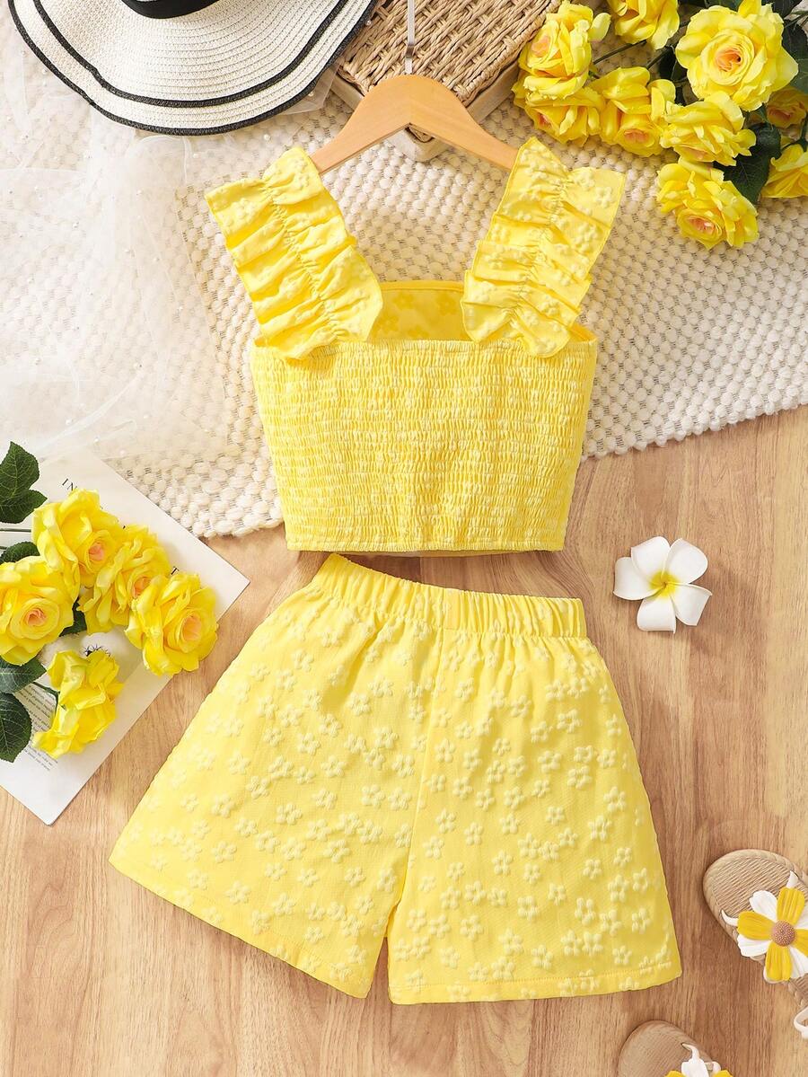 Apricot two-piece summer outfit for tween girls featuring a sleeveless pleated square-neck camisole top with button details and matching gathered shorts.