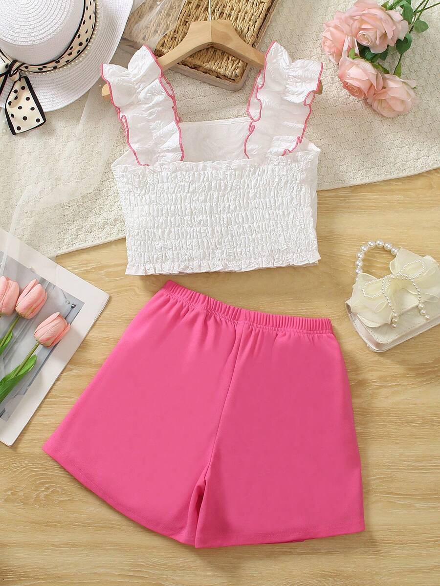 Apricot two-piece summer outfit for tween girls featuring a sleeveless pleated square-neck camisole top with button details and matching gathered shorts.
