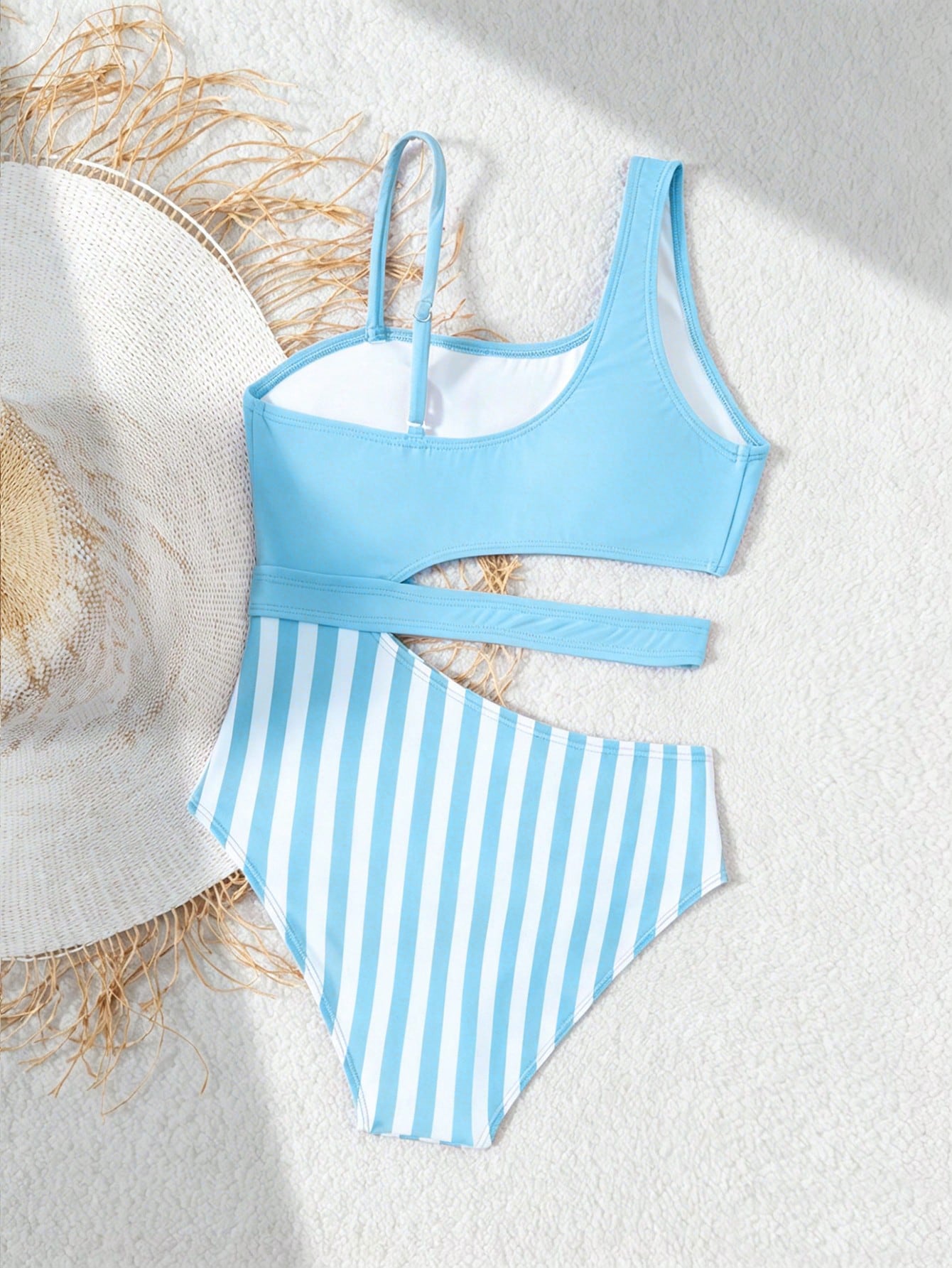 Purple tween girls one-piece swimsuit with asymmetrical neckline, cut-out waist, striped pattern, fitted silhouette, and lined body.