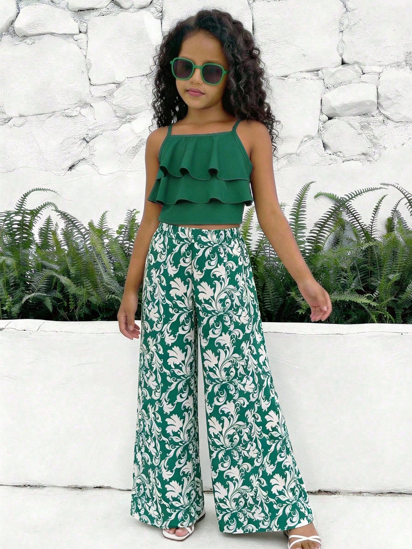 Tween girls blue 2-piece vacation outfit set featuring a tiered ruffle spaghetti strap camisole and loose high-waist pants.